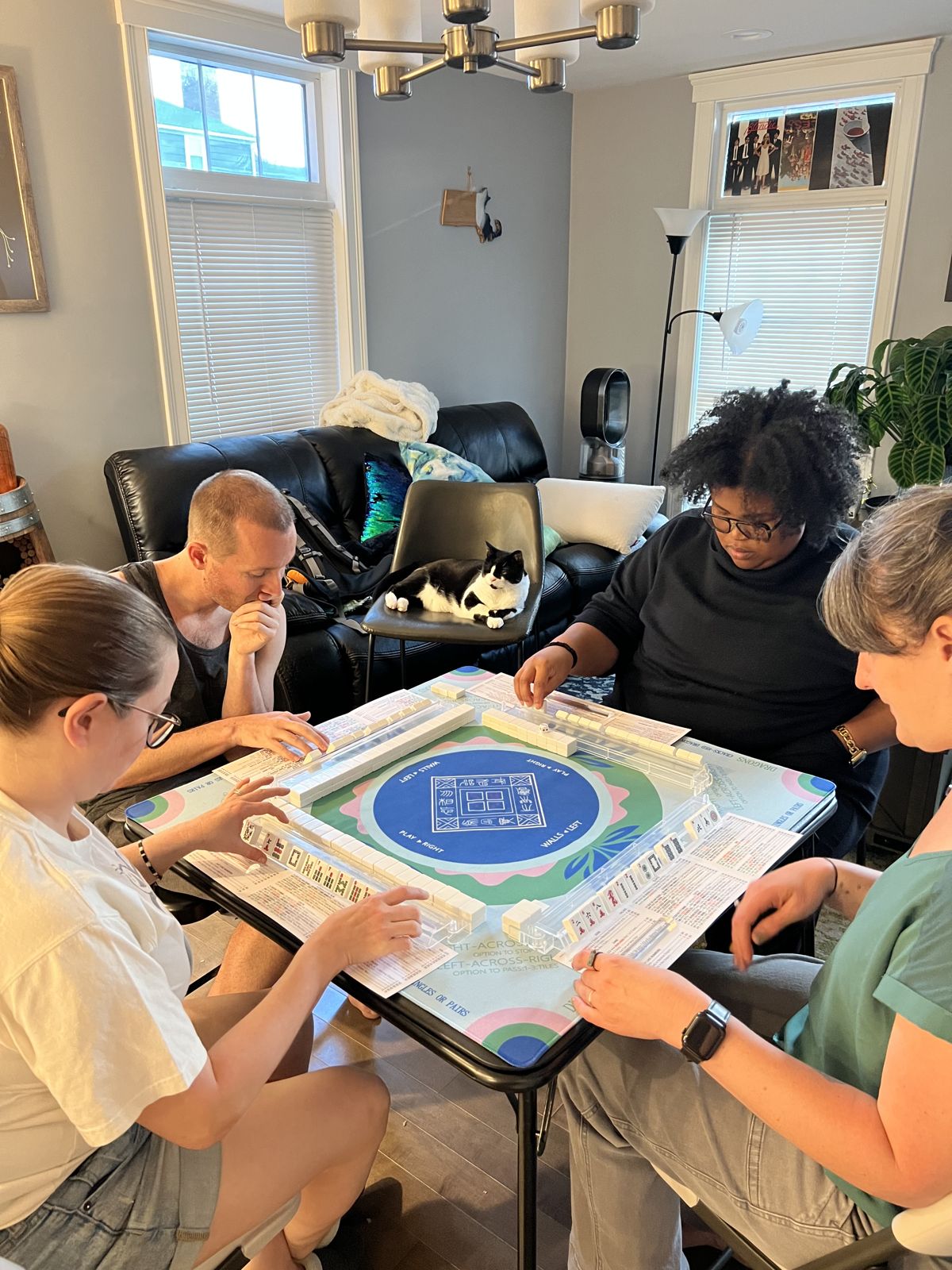 A private lesson at home, four players around the table